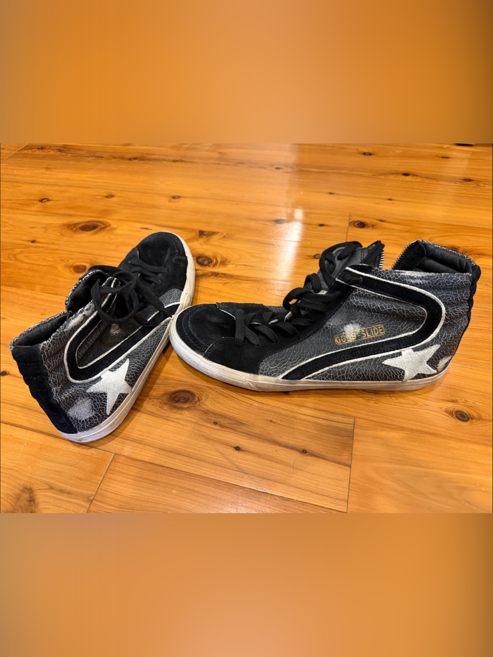 Golden Goose Black and White Mid-Top Sneakers with Star Accent